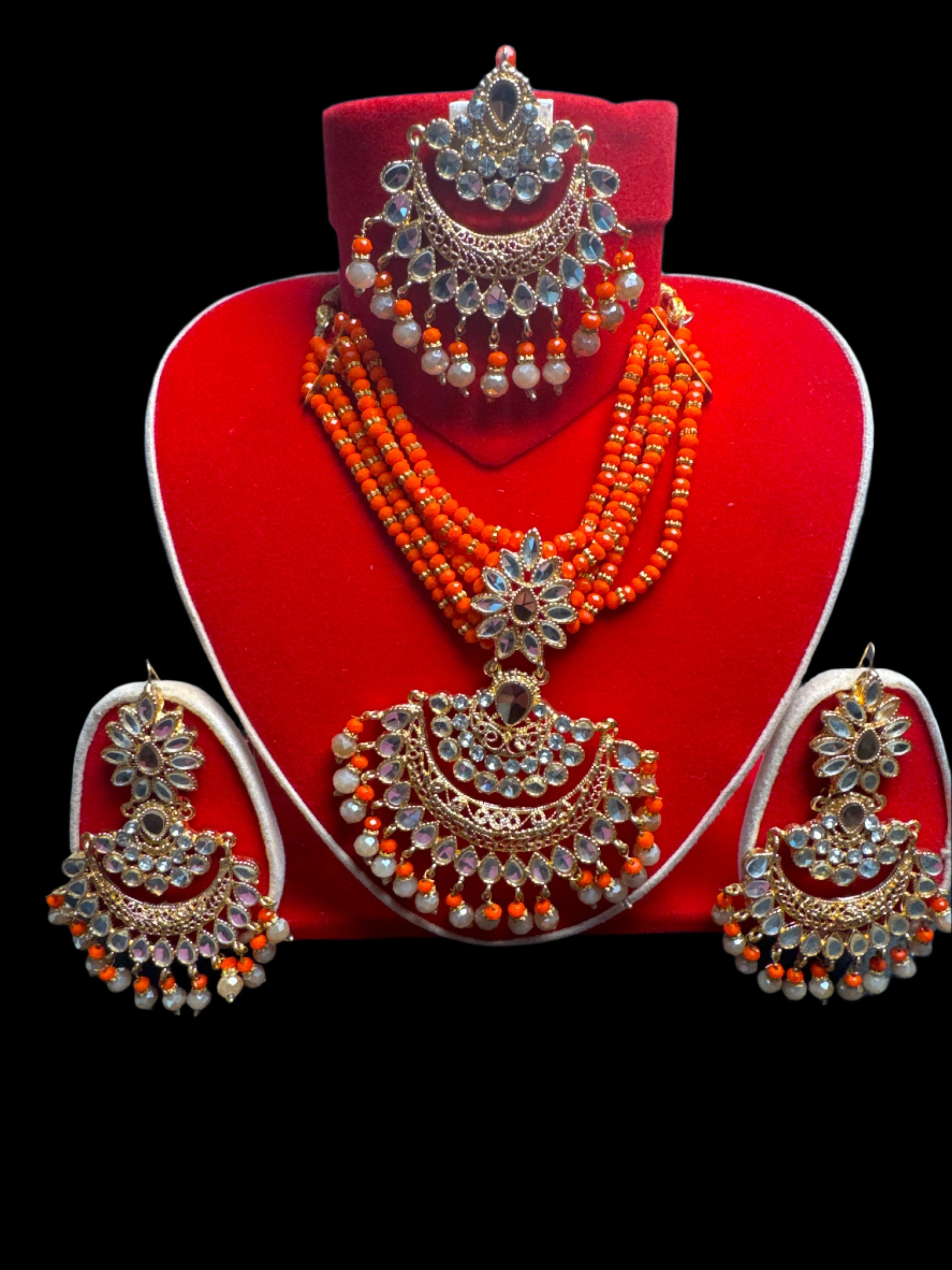 Gold colour Jewellery set with necklace, earrings and Teeka with orange & gold pearls -KS9