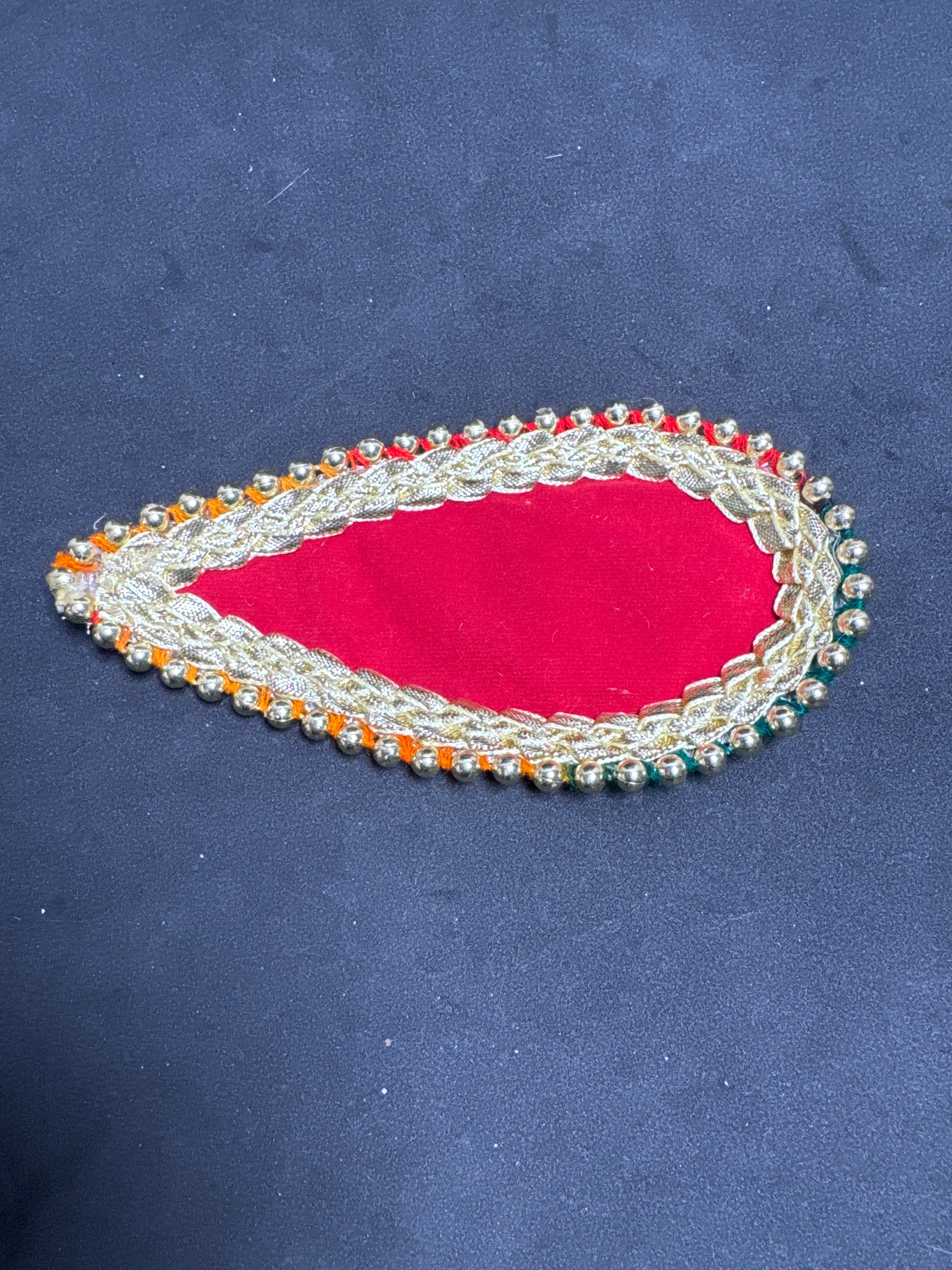 Mehndi Leaf with Gotta and Gems Elegant Design on Red Background Perfect for Traditional Mehndi Enthusiasts