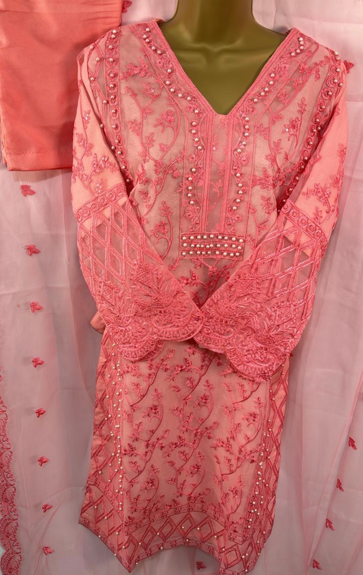 Three piece peach suit