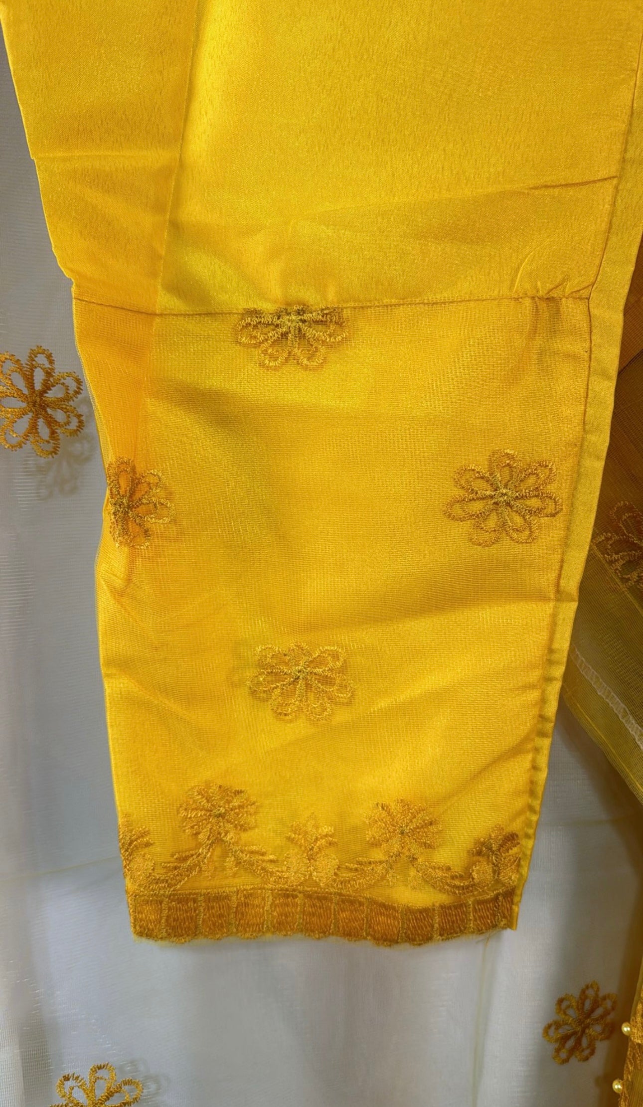 Yellow net frock with embroidery and bead work