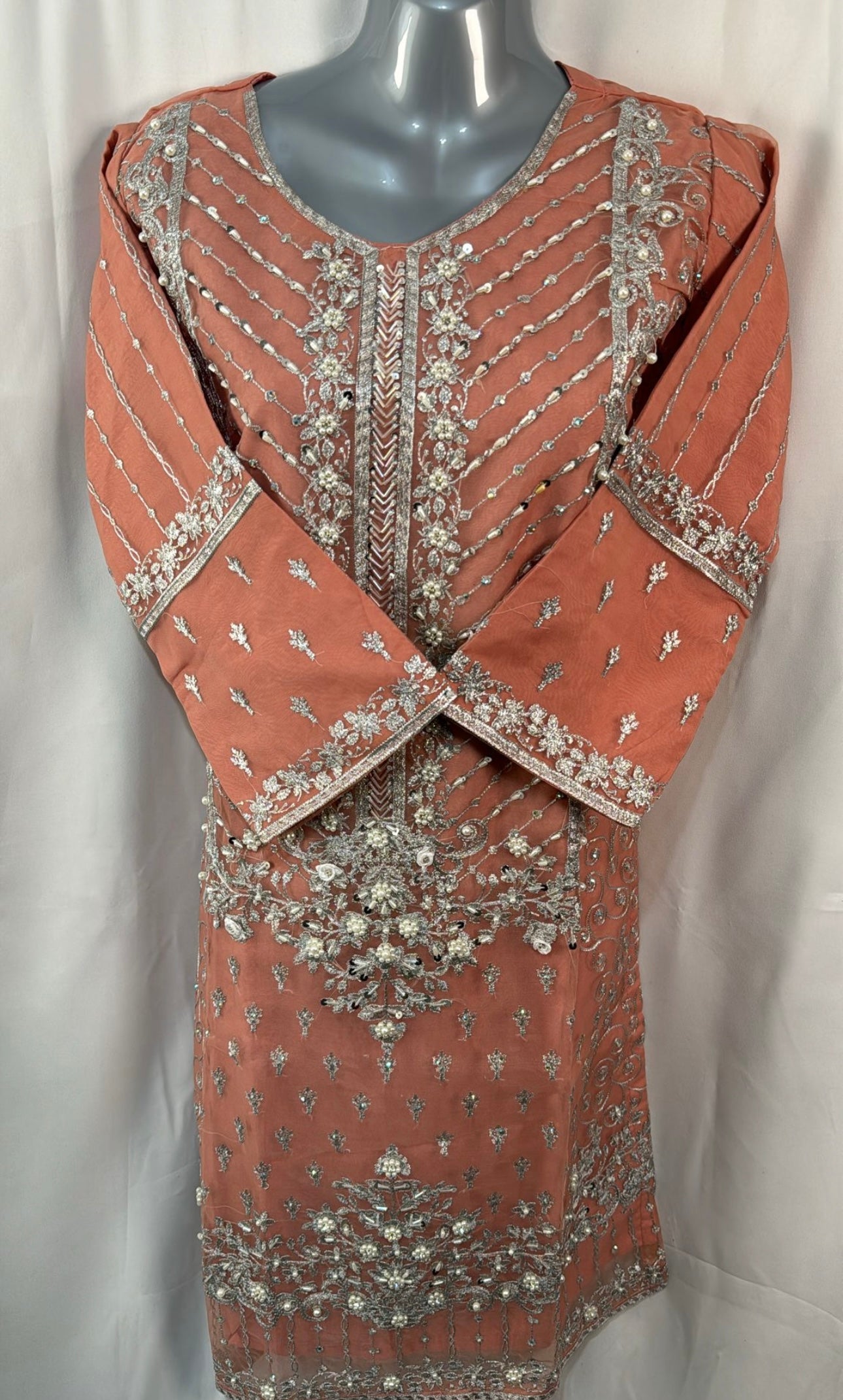 Peach three piece suit with embellishments