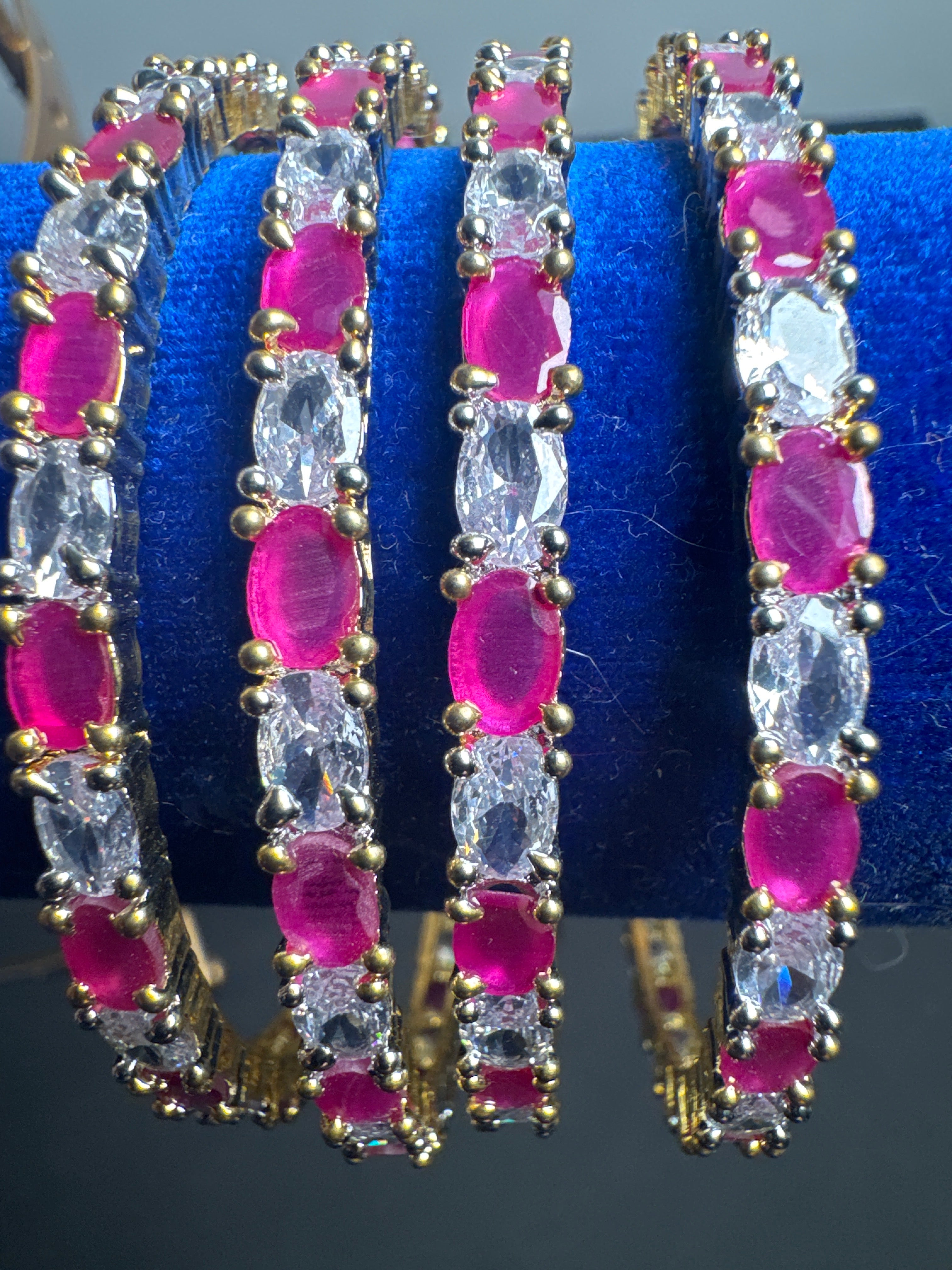 Gold colour set of 4 bangles with Pink crystal beads