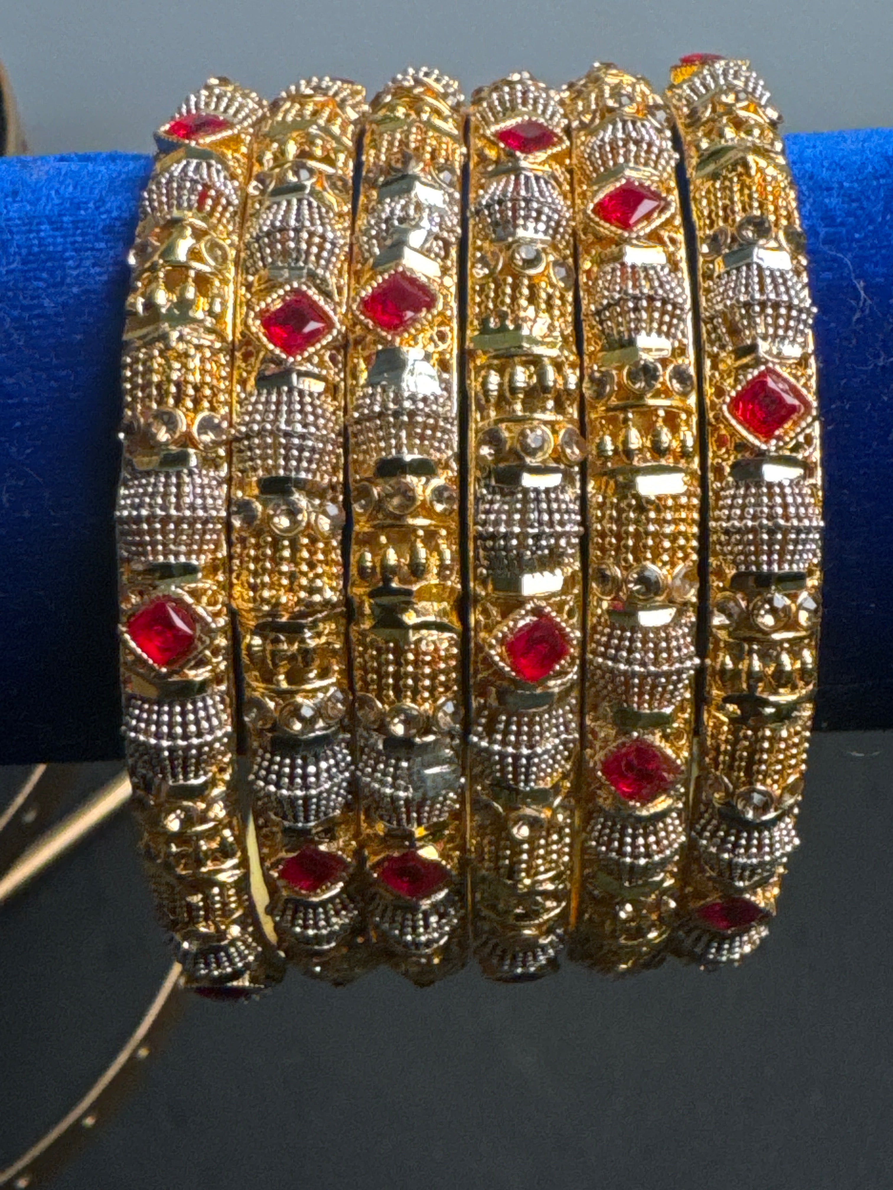 Golden set of 6 bangles with maroon pearls