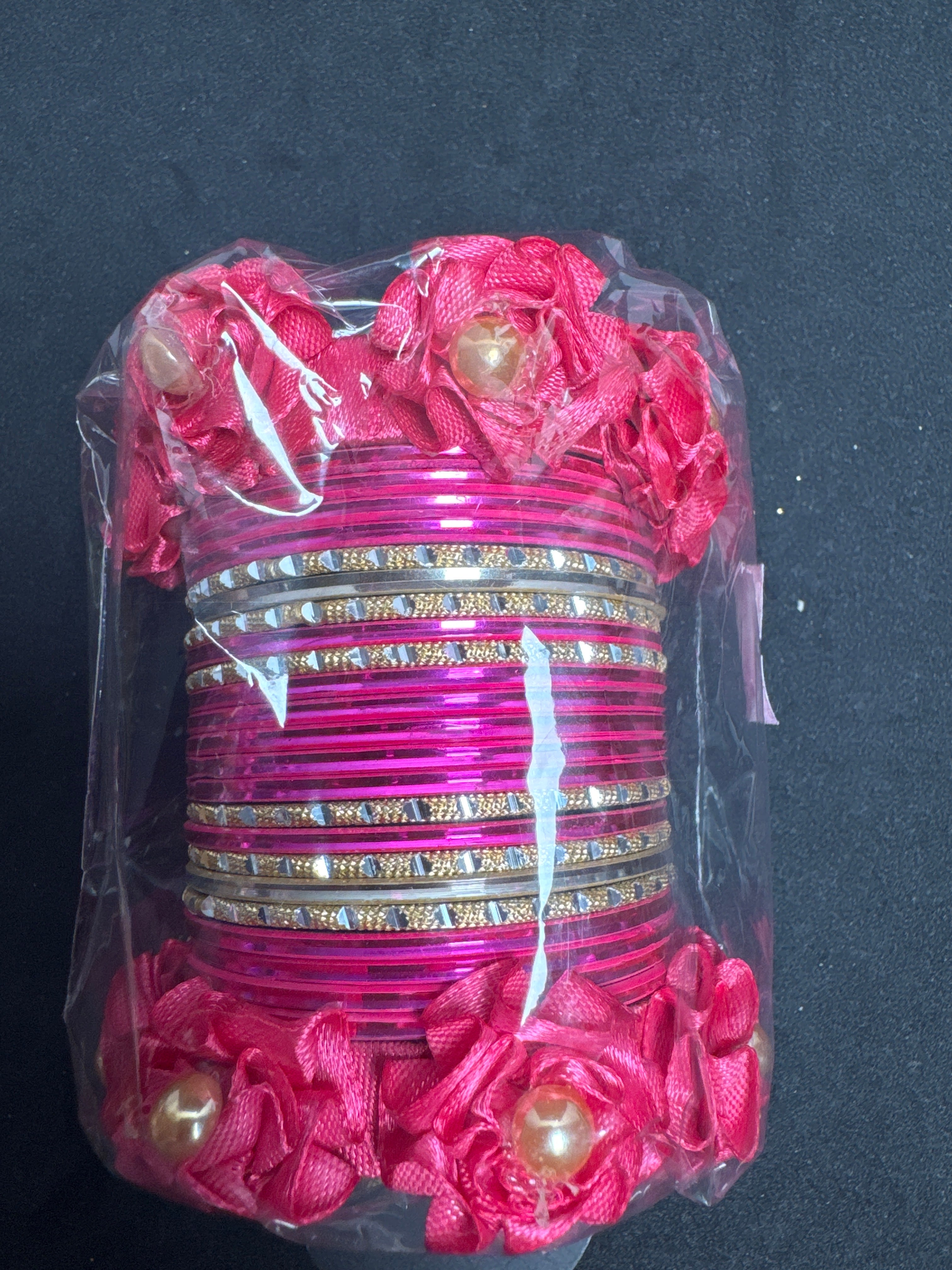 Flower bangles set in shocking pink B2