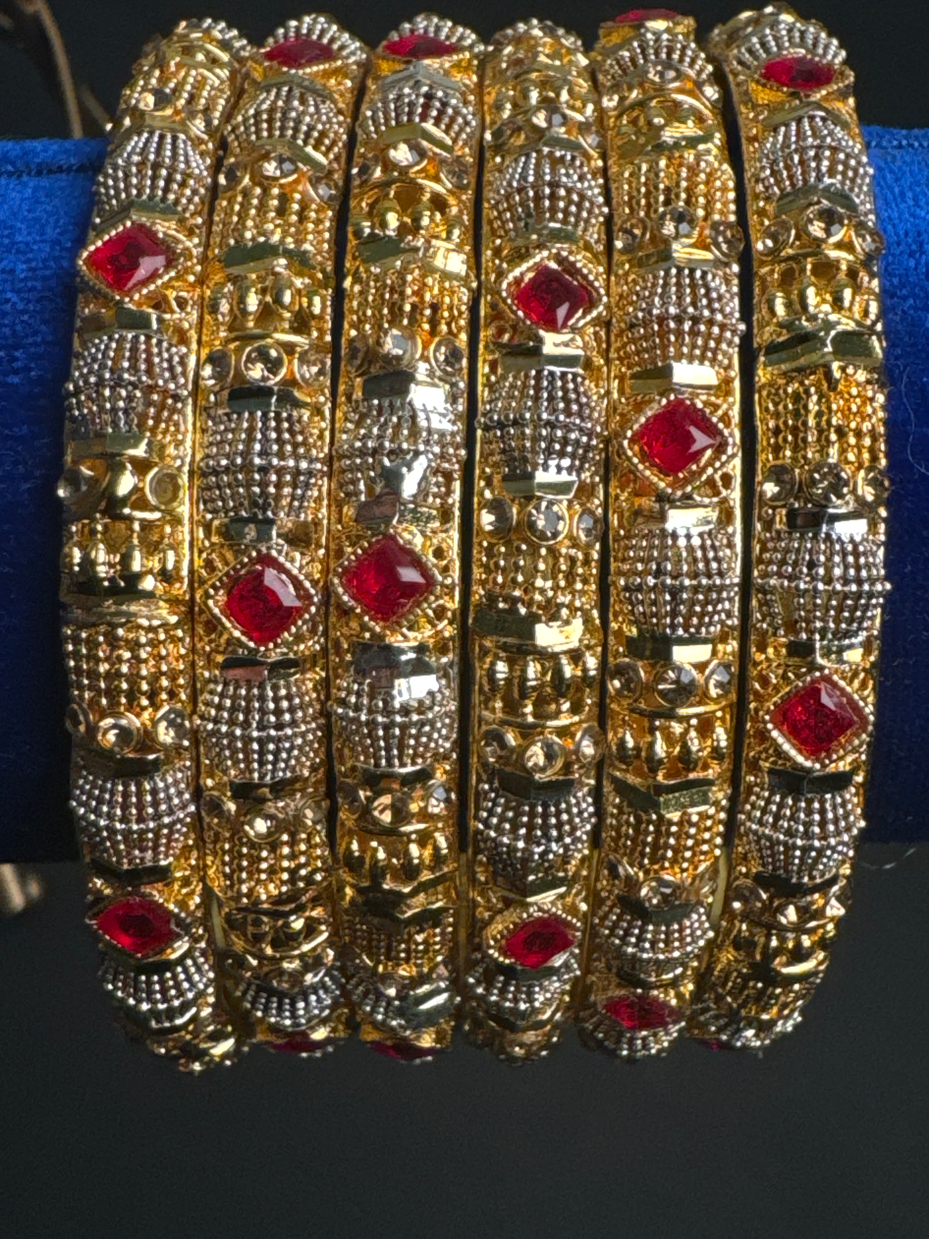 Golden set of 6 bangles with maroon pearls