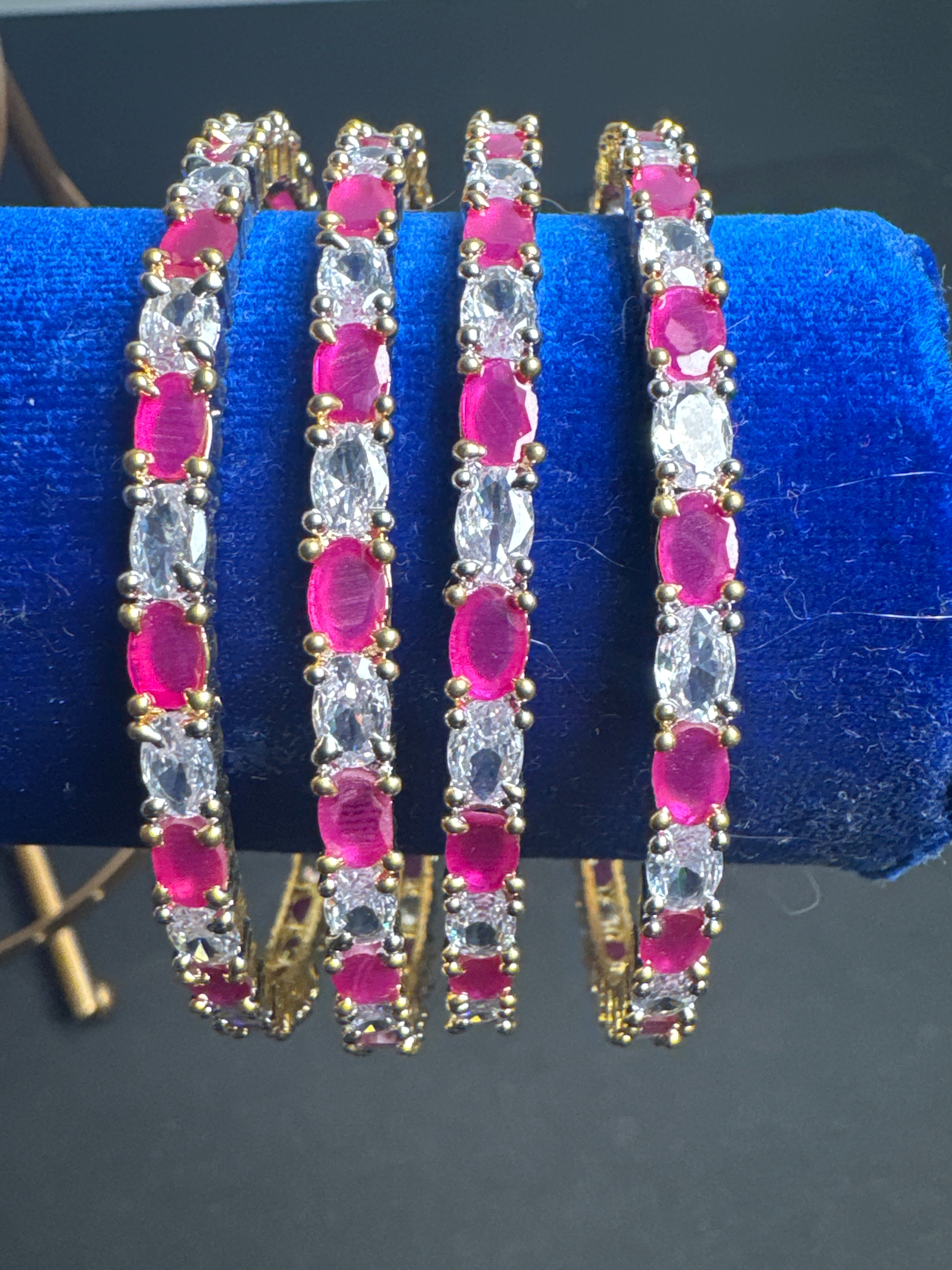 Gold colour set of 4 bangles with Pink crystal beads