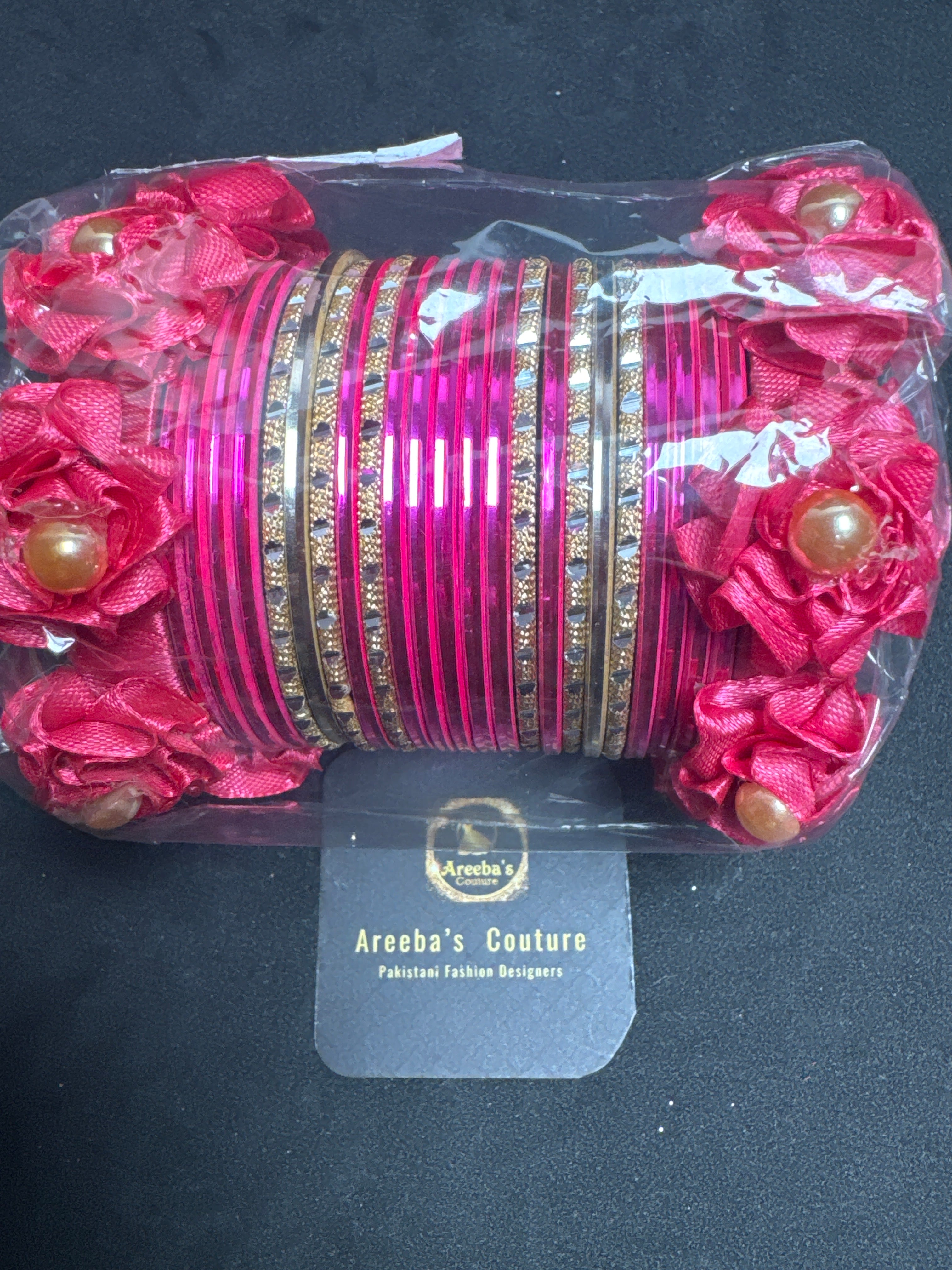 Flower bangles set in shocking pink B2