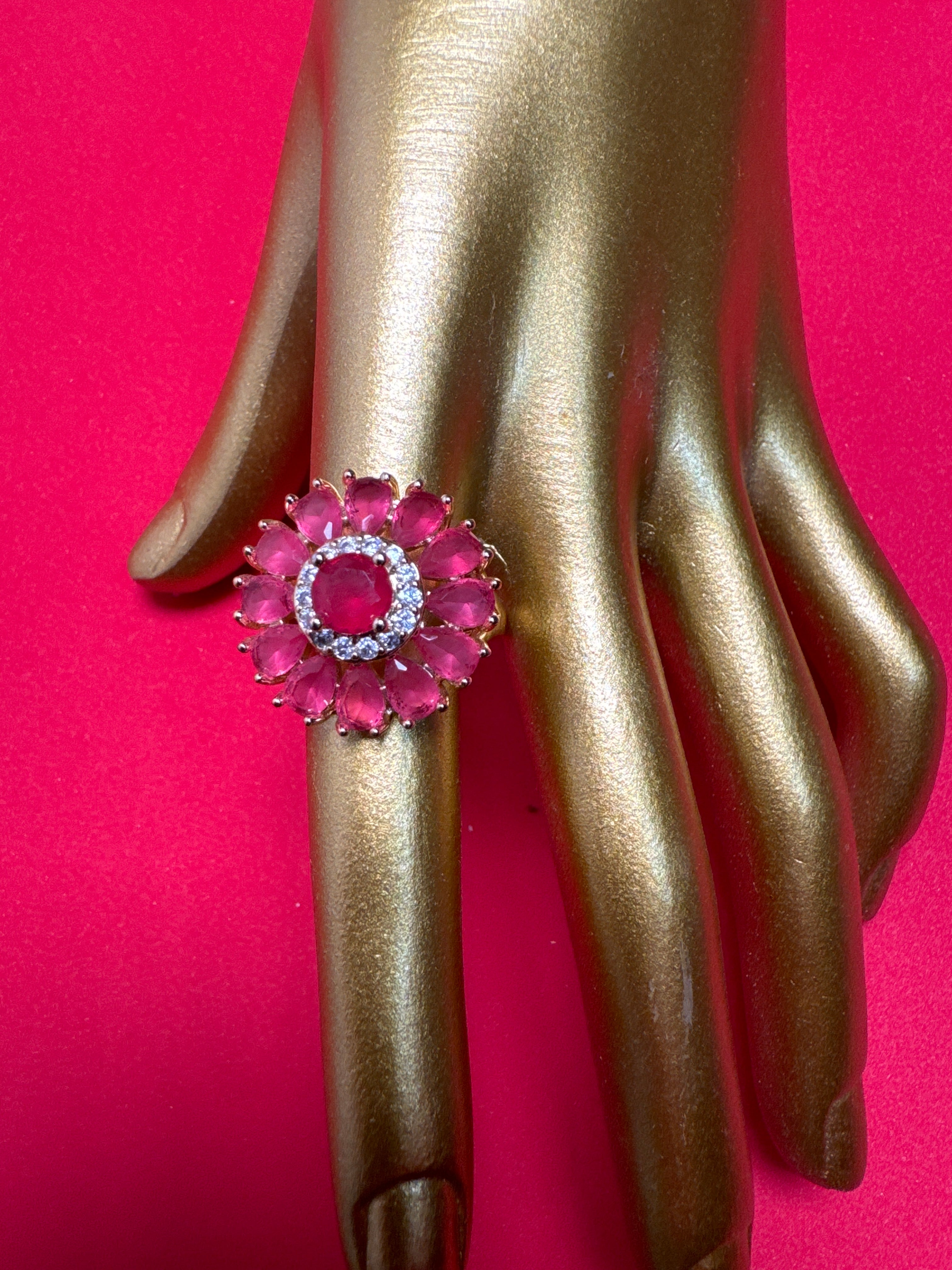 Gold ring with  pink beads