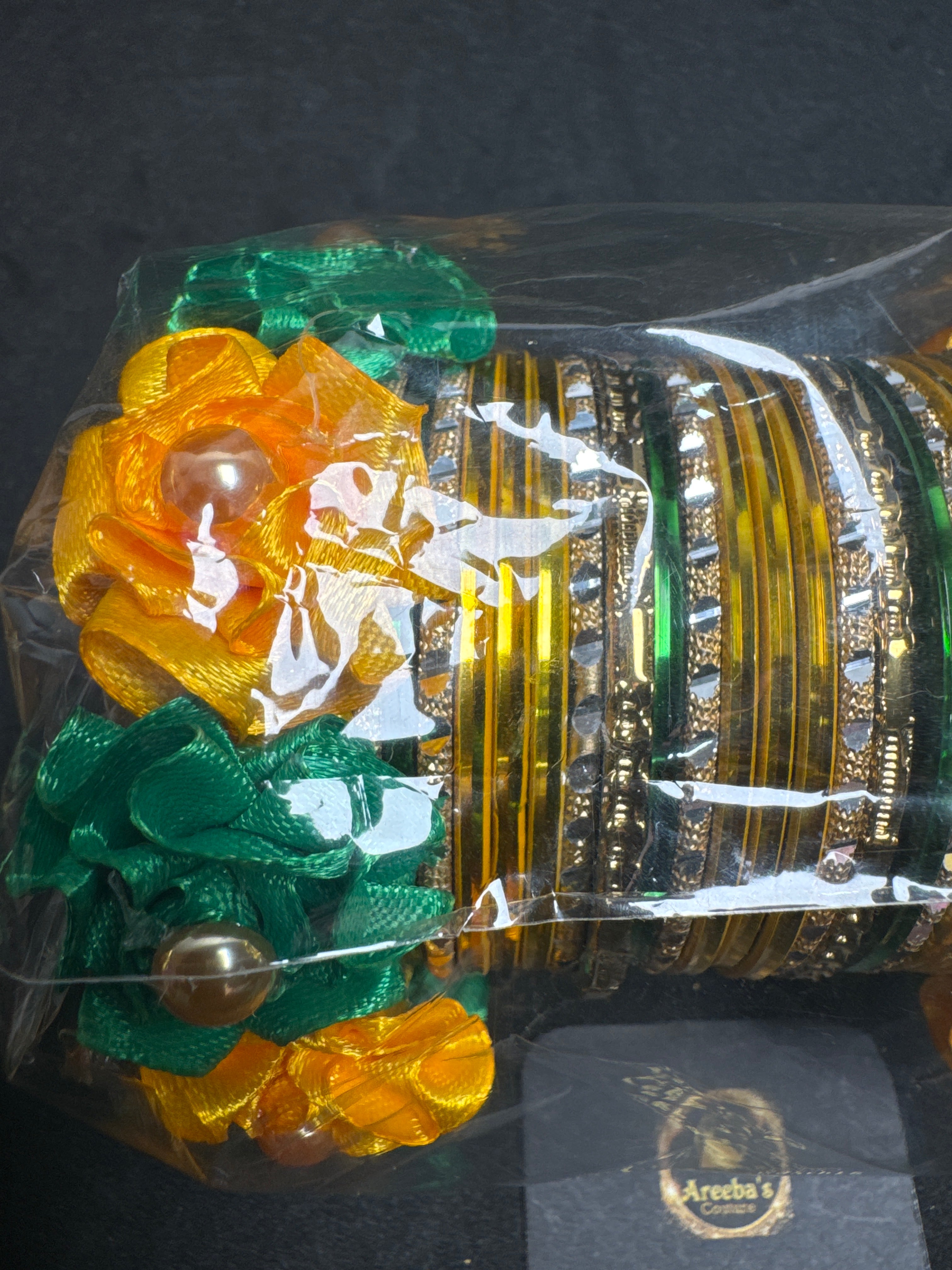 Yellow and green metal bangles with flower Kara