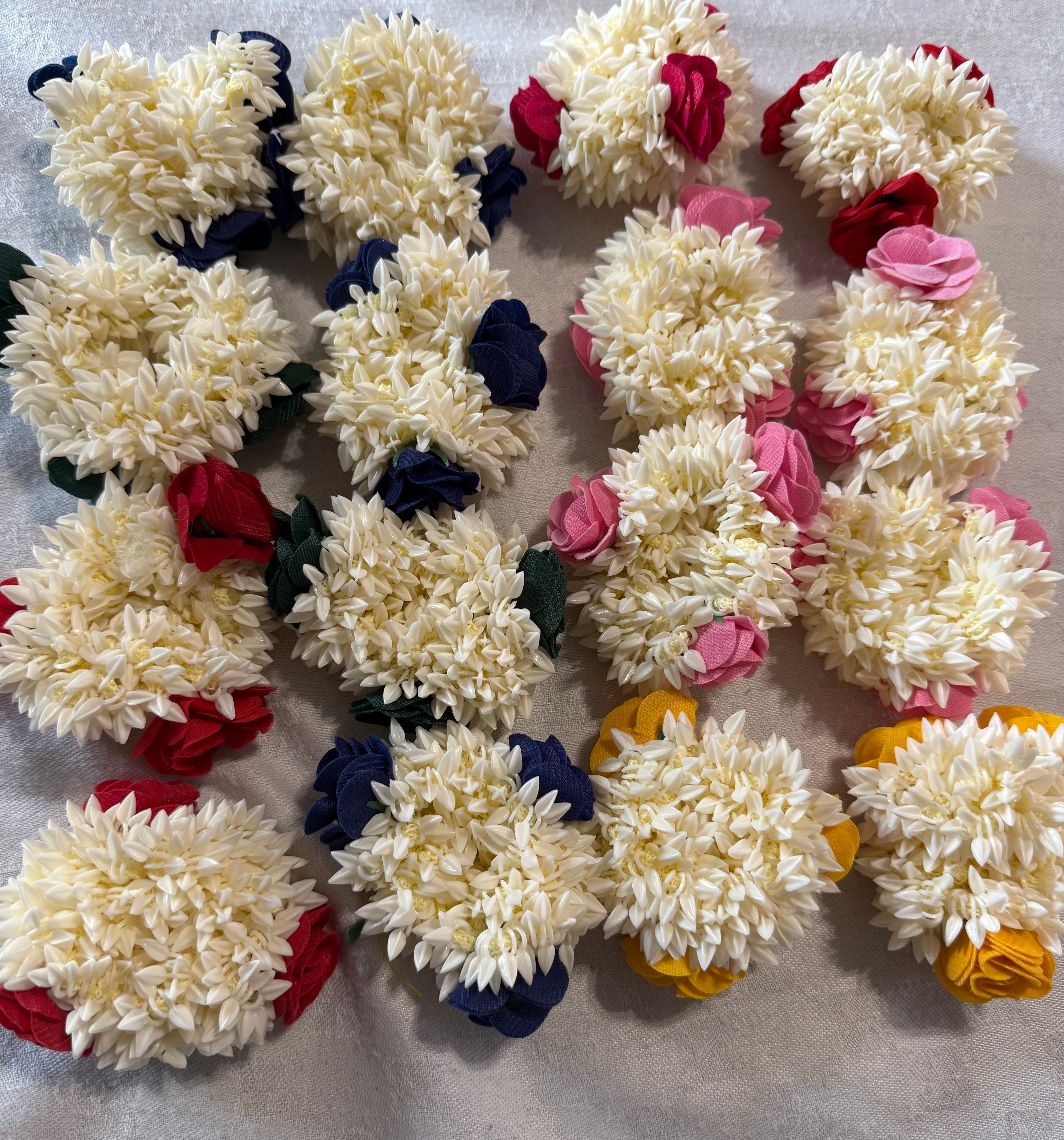 Pack of Artificial floweral gajras  multicolour for use on Mehndi/Halidi occasions or casual use - Pack of 12