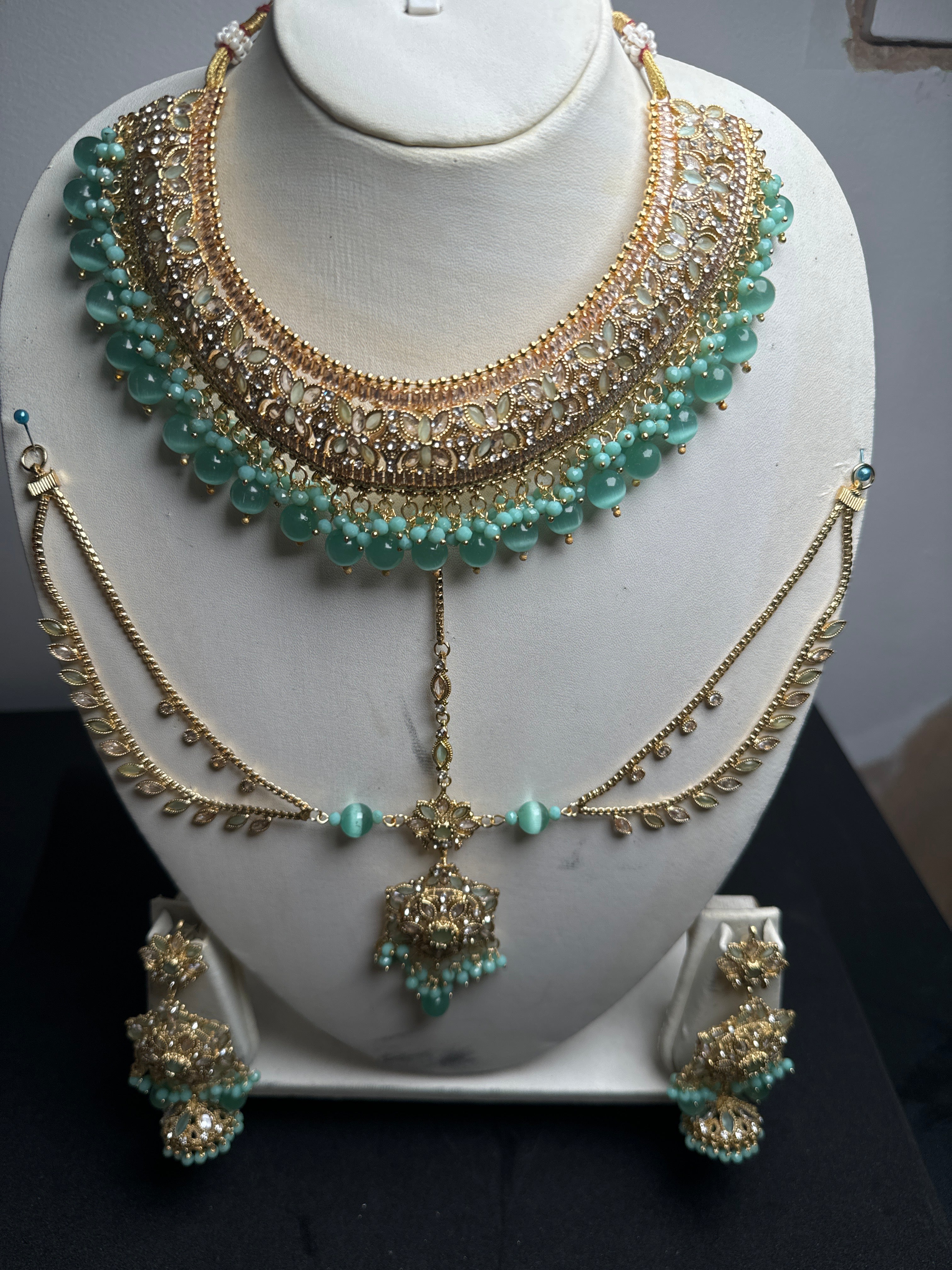 Gold colour Jewellery set with necklace, Jhumar. earrings and bindi with green pearls - JS47